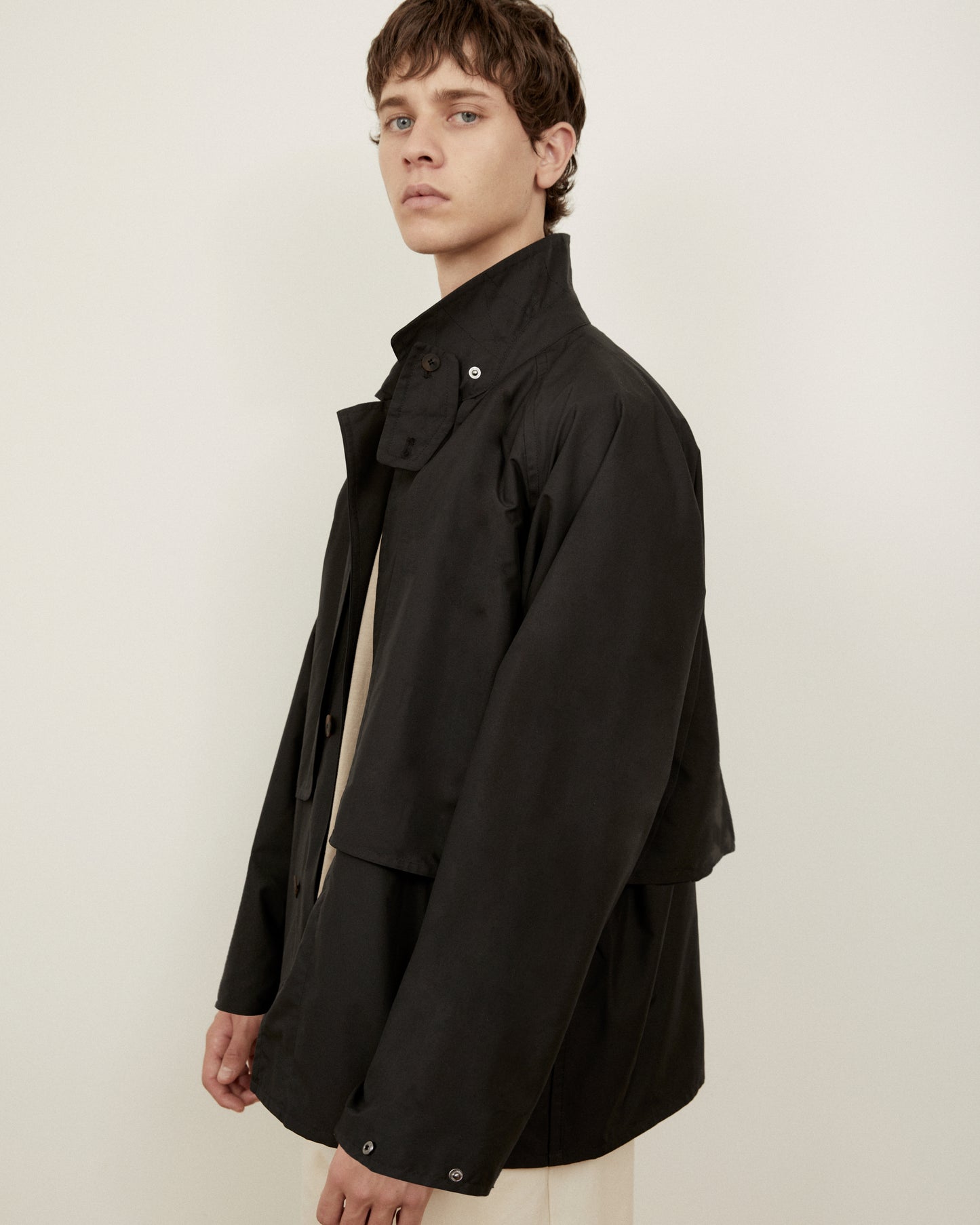 Morrow Australia Fashion black Dry jacket side on with storm flap showing
