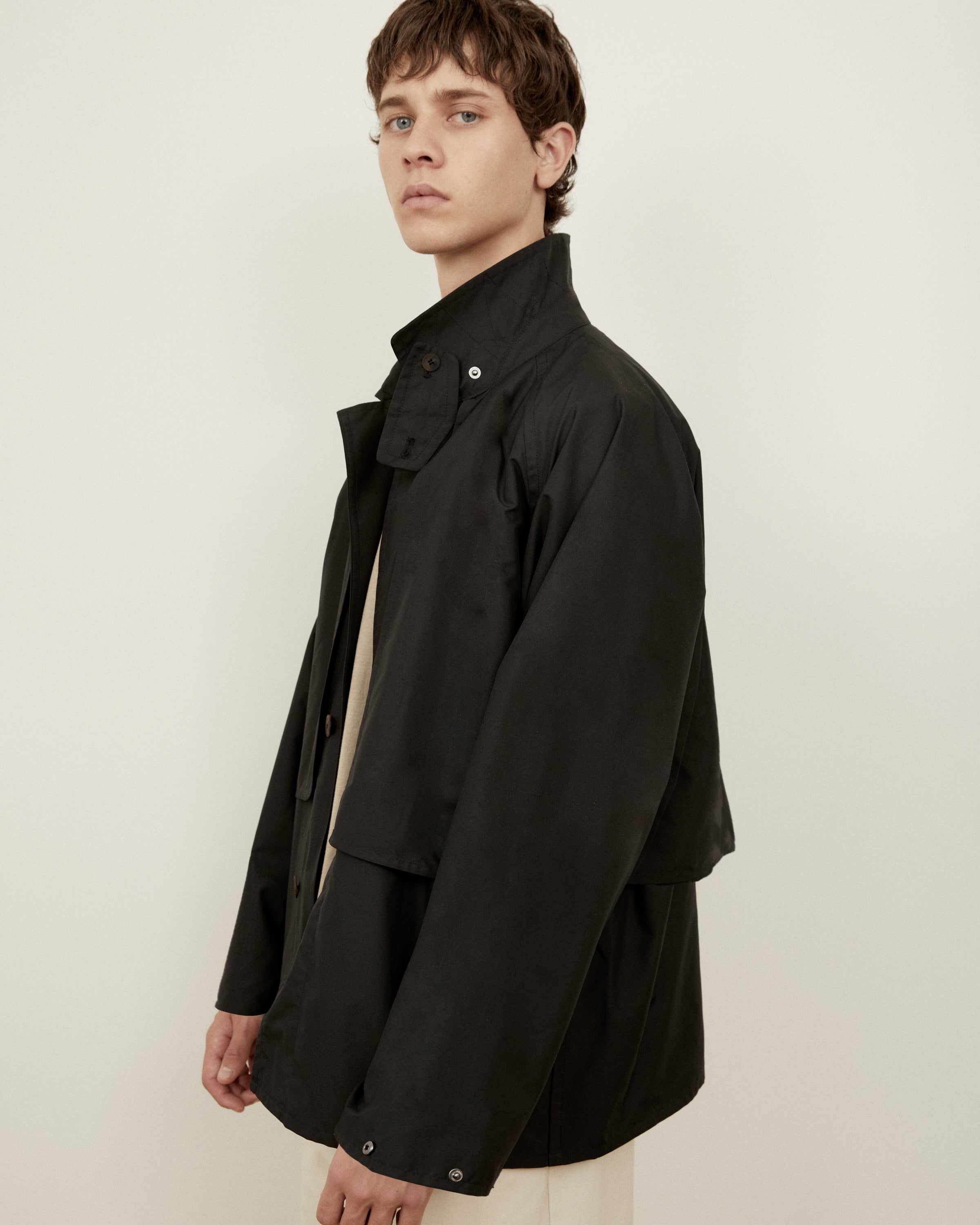Morrow Australia Fashion black Dry jacket side on with storm flap showing
